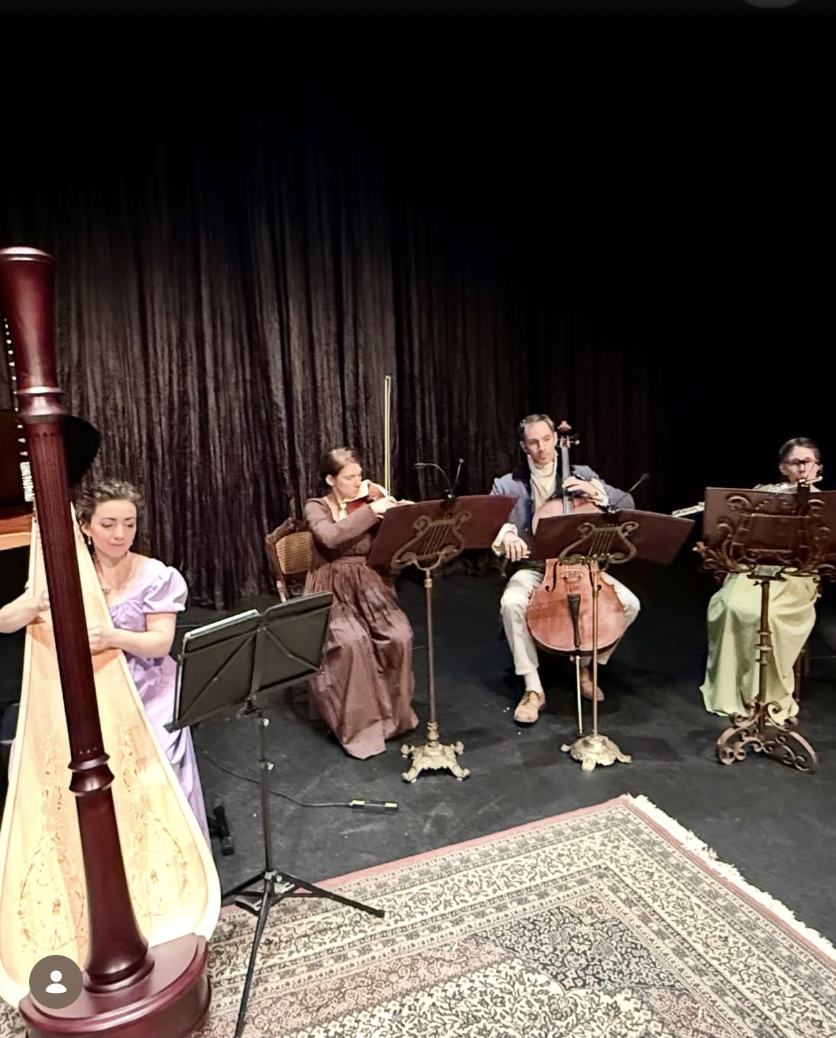 Christa Dalmazio at the harp with The Jane Austen Playlist ensemble in period costume, Zoellner Arts Center