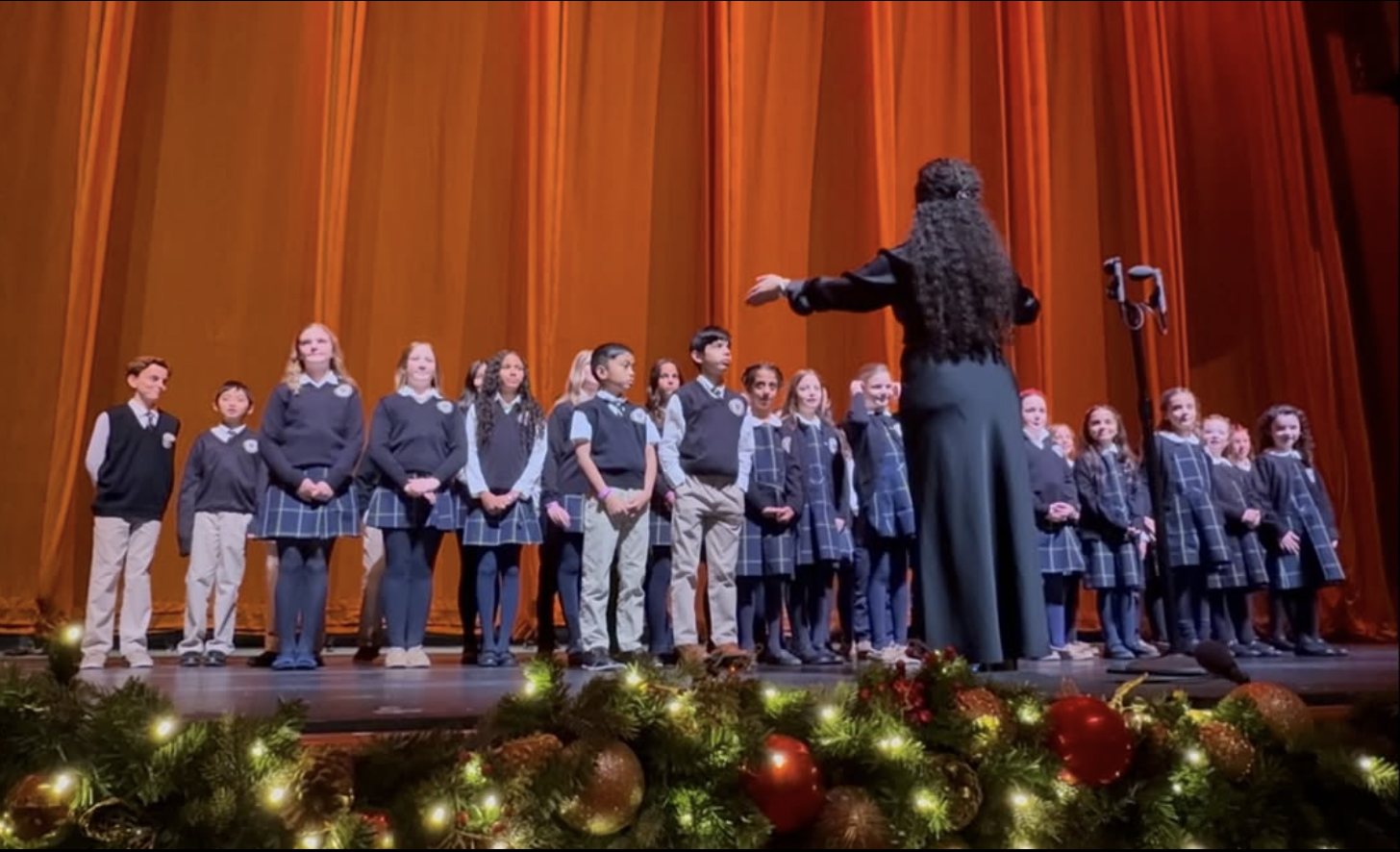 Christa Dalmazio conducting the Academy of Our Lady Sacred Music Choir at Radio City Music Hall
